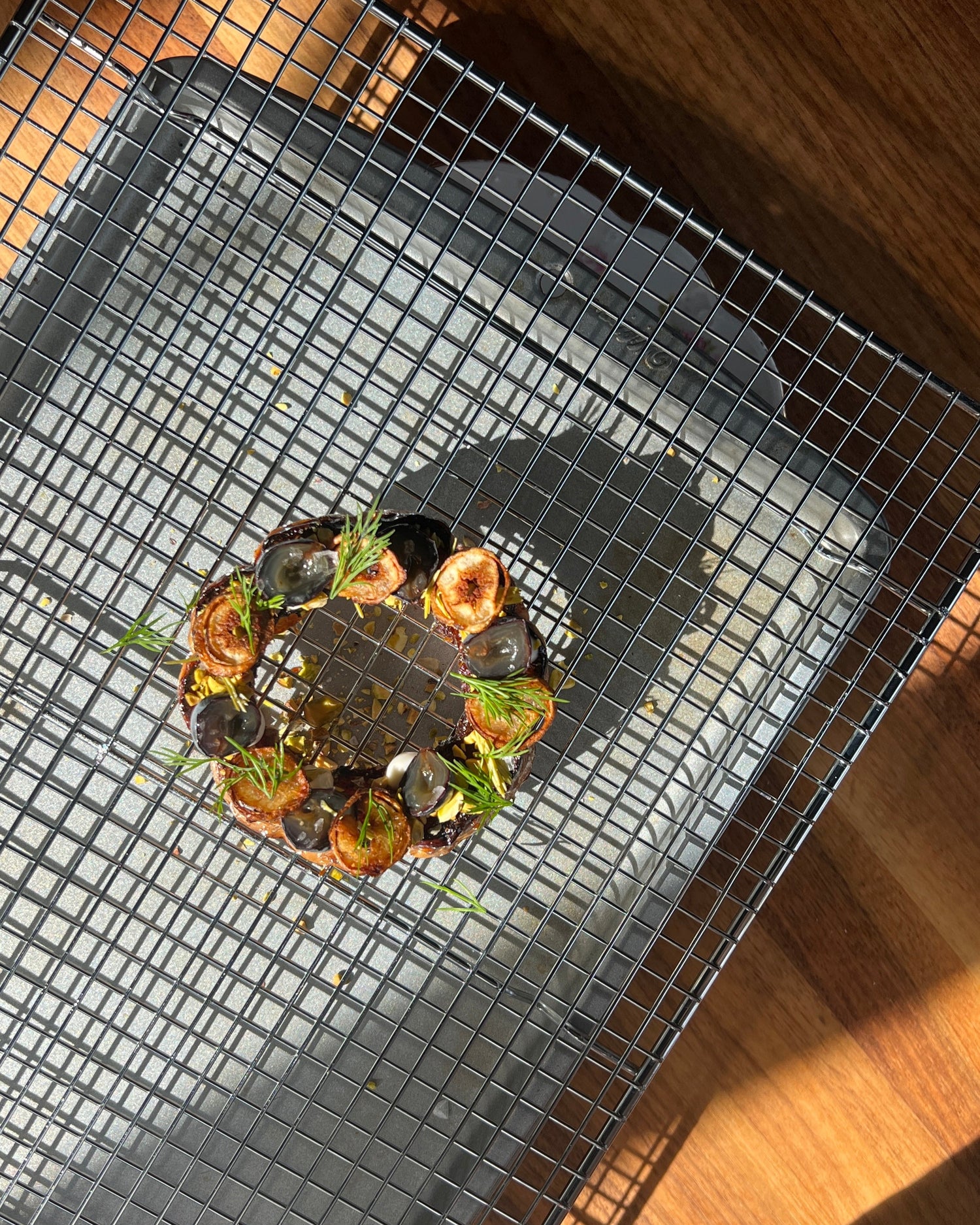Grill basket with food on a wooden surface